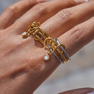 Three-link stacked gold and silver titanium steel ring with sparkling zircon charms