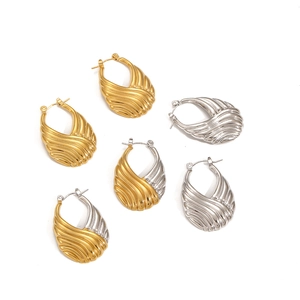 Unique handbag shaped stainless steel hoop earrings in gold and silver with wavy texture