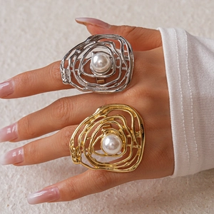 Exaggerated irregular hollow ring with large pearl in gold and silver finish