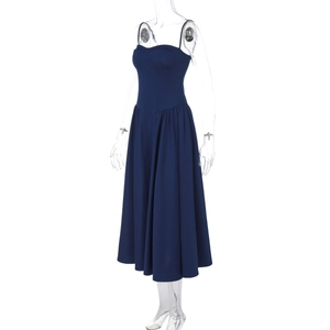 Detailed view of dark blue pleated midi dress with slim waist and tiered skirt