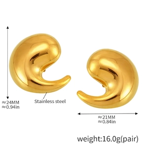 Macro view of teardrop swirl earrings in 18K gold plated stainless steel showing size