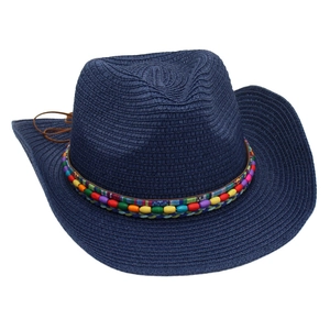 Detailed close-up of dark blue woven cowboy straw hat with colorful beaded ethnic band