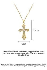 Macro detail of gold cross necklace featuring cubic zirconia inlay and 40cm chain