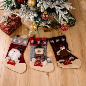 Three festive Christmas stockings with 3D Santa and Reindeer on a cozy holiday background