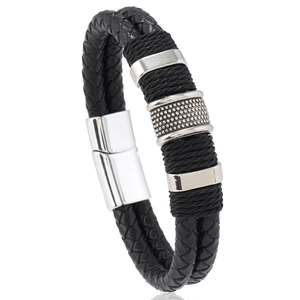 Detail of black braided leather bracelet with silver stainless steel magnetic clasp