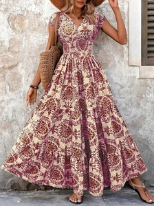 Detailed view of bohemian floral print on a V-neck maxi dress with lightweight fabric