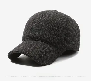 Close-up of textured tweed knit baseball cap with embroidered SPORT logo on the front