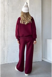 Rear view of burgundy sweatshirt and wide-leg joggers set with a cozy fleece texture