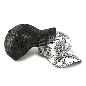 Black and white paisley pattern baseball caps with floral print in a structured design