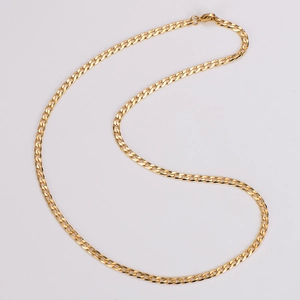 Detailed close-up of golden flat interlocking curb chain link necklace on white background