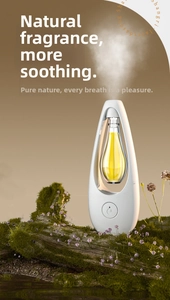 White water-drop fragrance diffuser releasing mist over natural mossy wood scenery