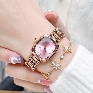 Elegant rose gold women's watch with pink dial and matching celestial star moon bracelet