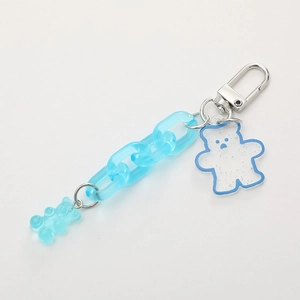 Acrylic keychain featuring blue glitter bear pendants and matching link chain
