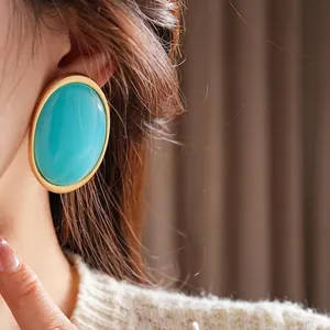 Vintage oval turquoise green resin earrings with matte gold frames for elegant women