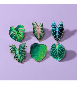 Detailed set of six tropical leaf pins with gold edges and colorful enamel textures