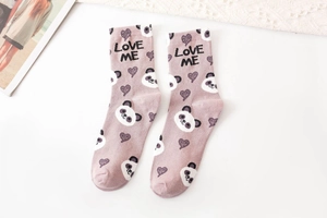 Detail of pink cotton crew socks featuring cute panda pattern and LOVE ME text design