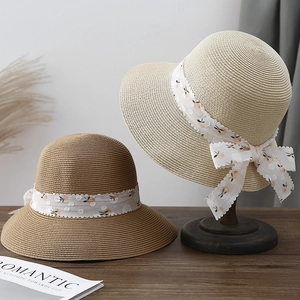 Bohemian straw sun hats with floral lace ribbons and wide brims for summer beach vacations