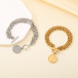 Layered stainless steel coin pendant bracelet with OT toggle clasp in gold and silver