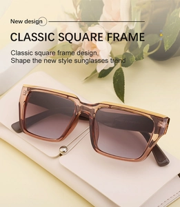 Classic square frame sunglasses in tea brown with gradient lenses on a leather case