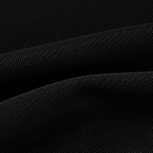Close-up of black double-layer mesh fabric with fine textured knit for summer dresses