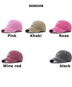 Detail showing five colors of washed cotton baseball caps with heart embroidery