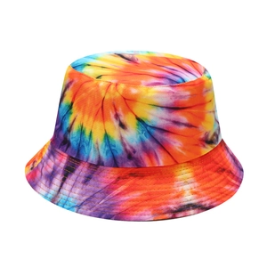 Detailed view of colorful tie-dye patterns and fabric texture on a reversible bucket hat