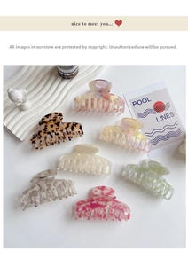 Flat lay of colorful acetic acid hair claws in leopard and marble patterns