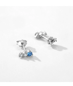 Detail of silver S925 earrings with three sparkling zircons in a delicate curved design