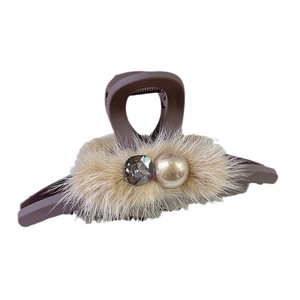 Brown plush hair claw clip with faux pearls and rhinestones on white background