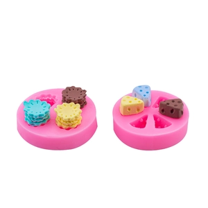 Pink silicone molds for crafting mini cheese and flower shaped cake decorations