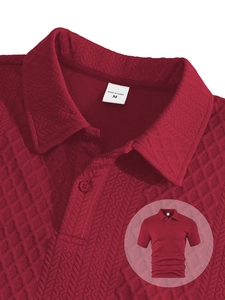 Close-up of wine red men's polo shirt featuring waffle knit texture and collared neckline
