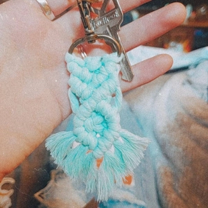 Handmade mint green macrame keychain with boho woven cotton rope and elegant tassels