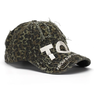Close-up of leopard print baseball cap featuring 3D TQ embroidery and distressed details