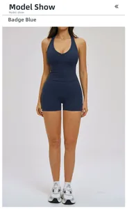 Detail of cross-back yoga top and high-waist shorts in badge blue performance fabric