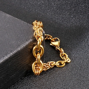 Close-up of golden dragon scale and O-link chain bracelet with lobster clasp