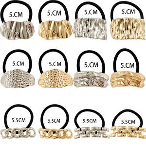 Detailed view of alloy hair ties in gold and silver showing wave and chain textures