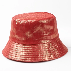 Detail of red metallic bucket hat featuring reflective faux patent leather and vertical textures
