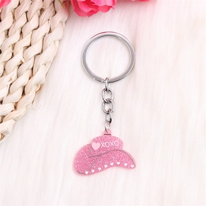 Porte-clés chapeau de cowboy rose à paillettes avec texte XOXO et motifs de cœurs