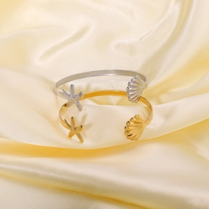 Polished stainless steel adjustable ocean bangles with starfish and seashell motifs