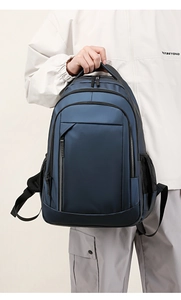 Blue large capacity waterproof backpack with multiple zipper compartments and side mesh pockets