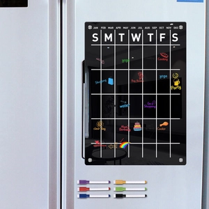 Detail of magnetic acrylic weekly calendar board for fridge with six colored markers