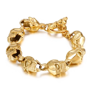 Mens skull link bracelet in polished gold steel with a secure T-bar toggle clasp