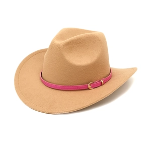 Close-up of khaki felt cowboy hat with pink leather belt and golden buckle detail