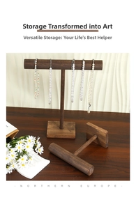 Detail of vintage walnut wood T-bar jewelry stand for necklaces and bracelets