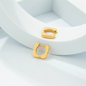 Minimalist square golden stainless steel hoop earrings on a white geometric display