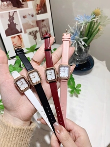 Detail of luxury square watches with diamond bezel and leather straps in four colors