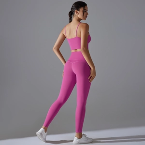 Hot pink yoga set featuring sports bra and high-waisted leggings from a side-back view