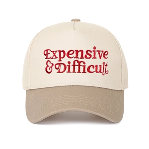 Close-up of red Expensive & Difficult embroidery on a contrast five-panel baseball cap