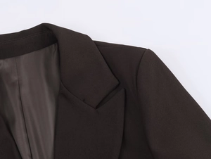 Detail of notched lapel and padded shoulder on professional twill suit jacket