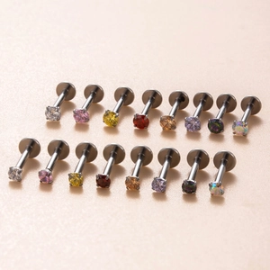 Detailed grid of titanium labret studs with colorful round-cut cubic zirconia inlays